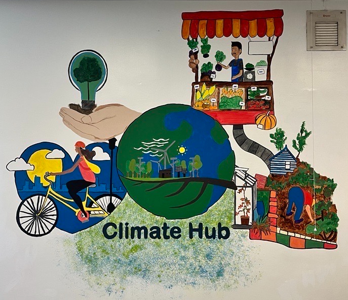 climate hub mural with colourful drawings of sustainable related images