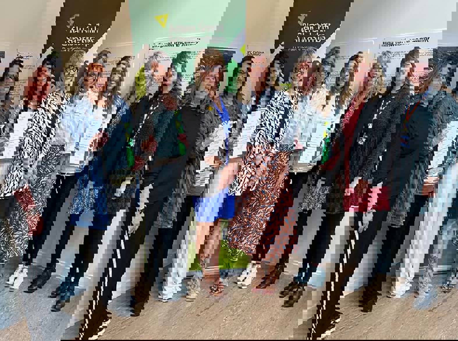 A group of people at a scholarship presentation