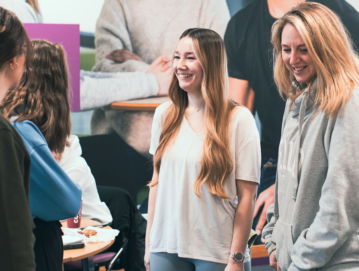 group of students smiling in class