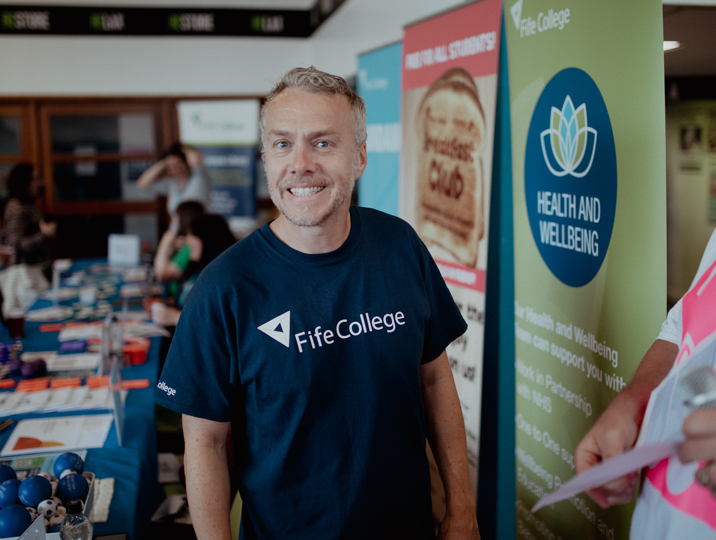 health and wellbeing staff member john smiling at camera