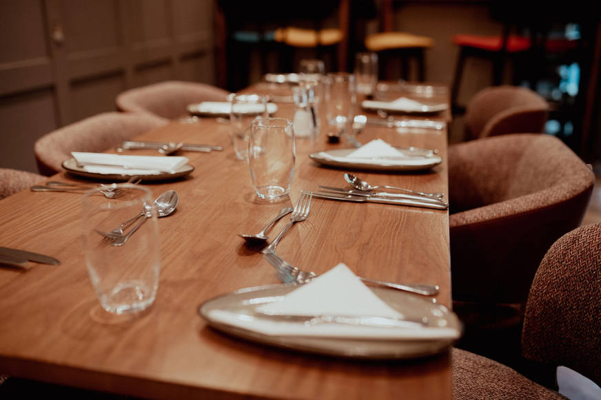 long table set at academy restaurant