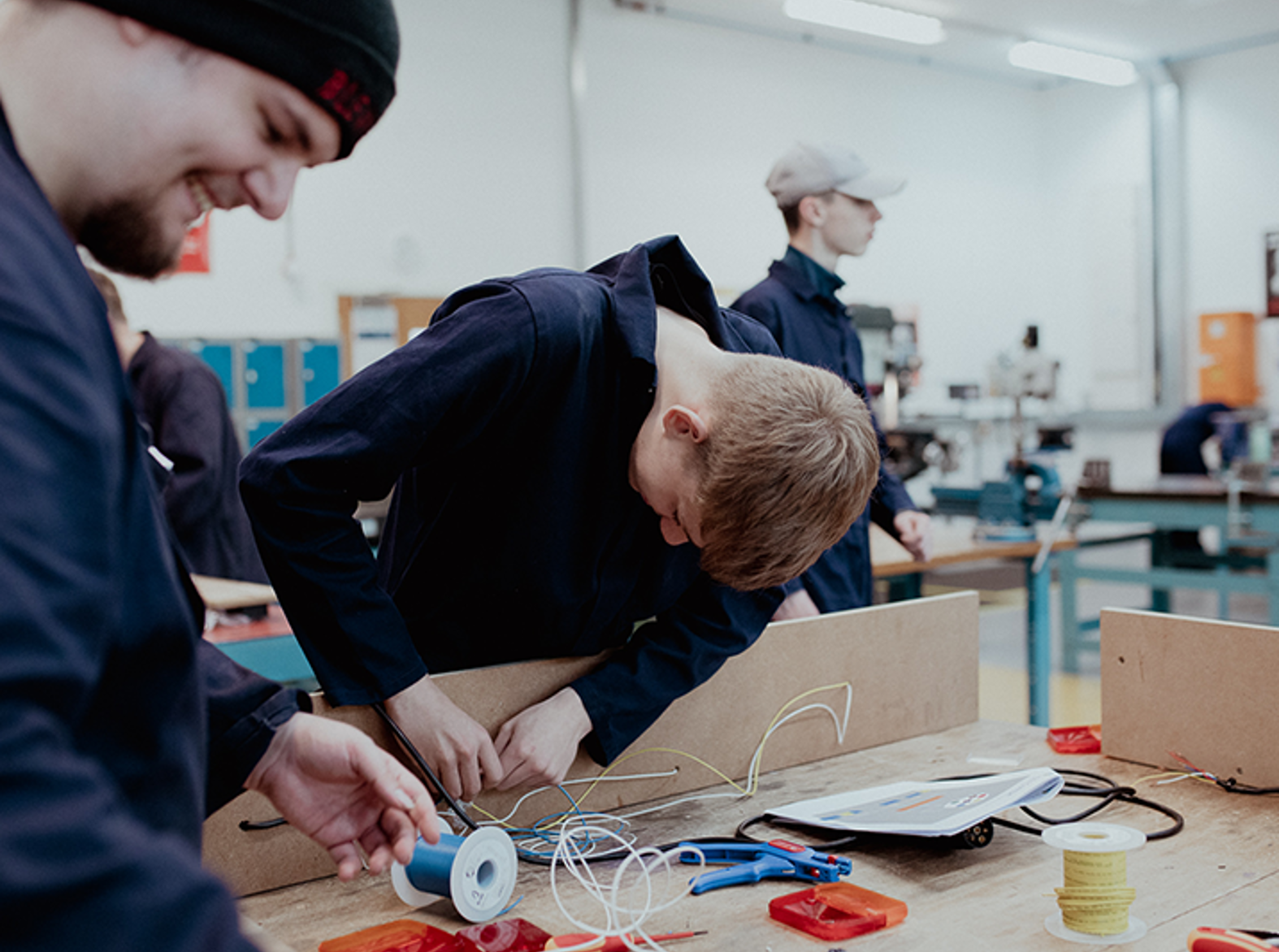 electrical students working on equipment