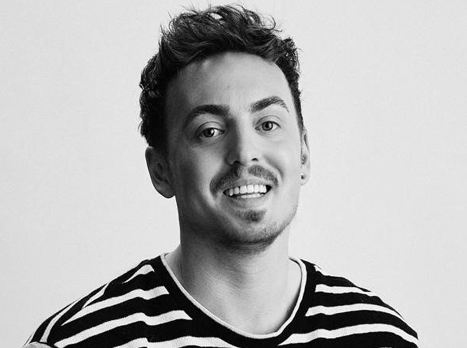 Headshot of man with striped t-shirt