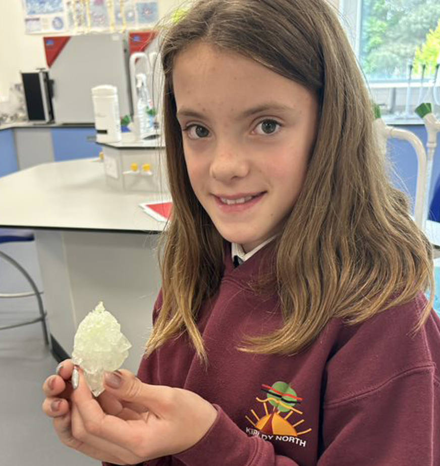 School pupil holding a crystal