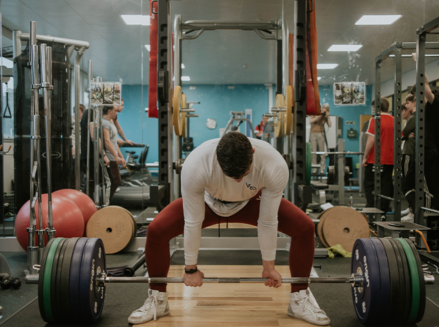 man deadlifting weight