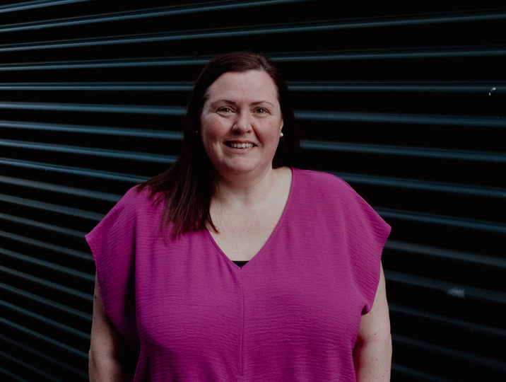 school college partnership staff member denise smiling at camera