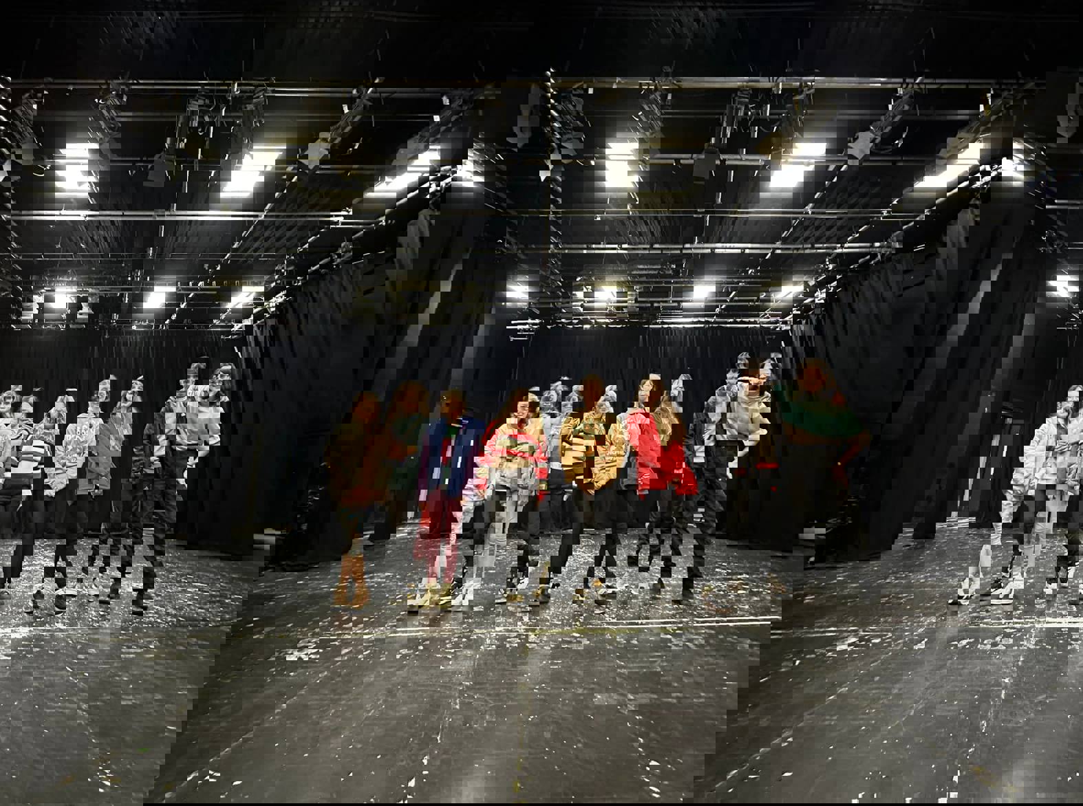 group of eight studio thirty eight students smiling at camera