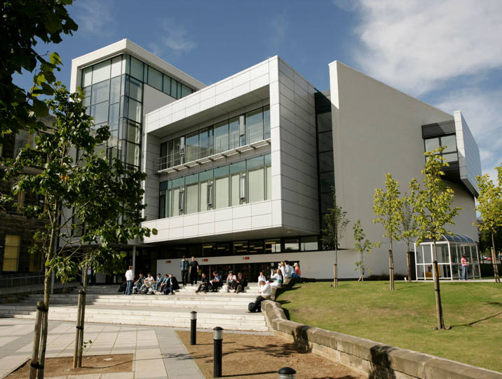 Kirkcaldy campus surrounded by trees and blue skies