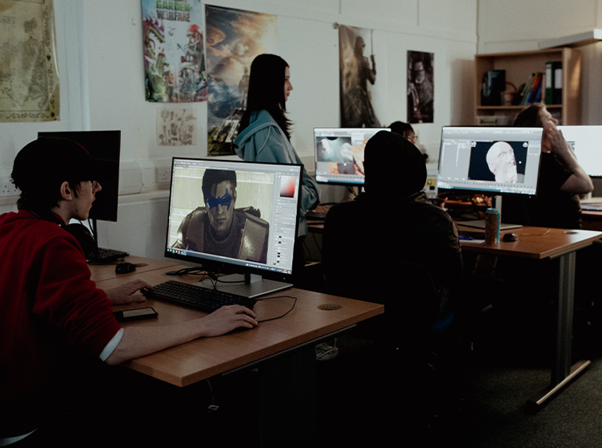 digital students in classroom working on computers